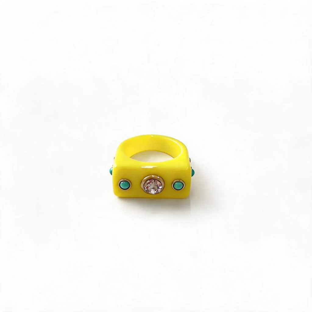 Bright yellow thick square resin ring decorated with central crystal rhinestone and turquoise enamel studs, fashion statement jewelry